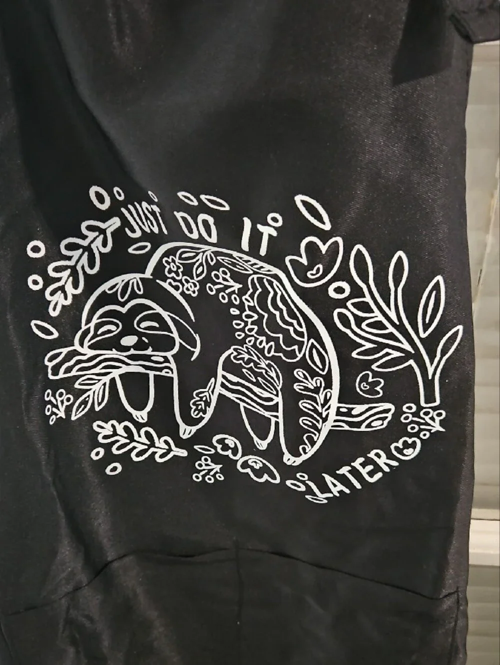 NWT Black Apron with White Sloth Graphic - 